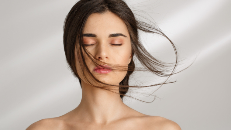 Unveiling Your Feminine Radiance: 10 Tips to Embrace Elegance 1 beautiful woman after spa procedures enjoying herself eyes closed