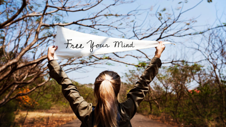Pursuing Passions, Embracing Joy, and Creating a Fulfilling Life 1 girl holding free your mind flag banner